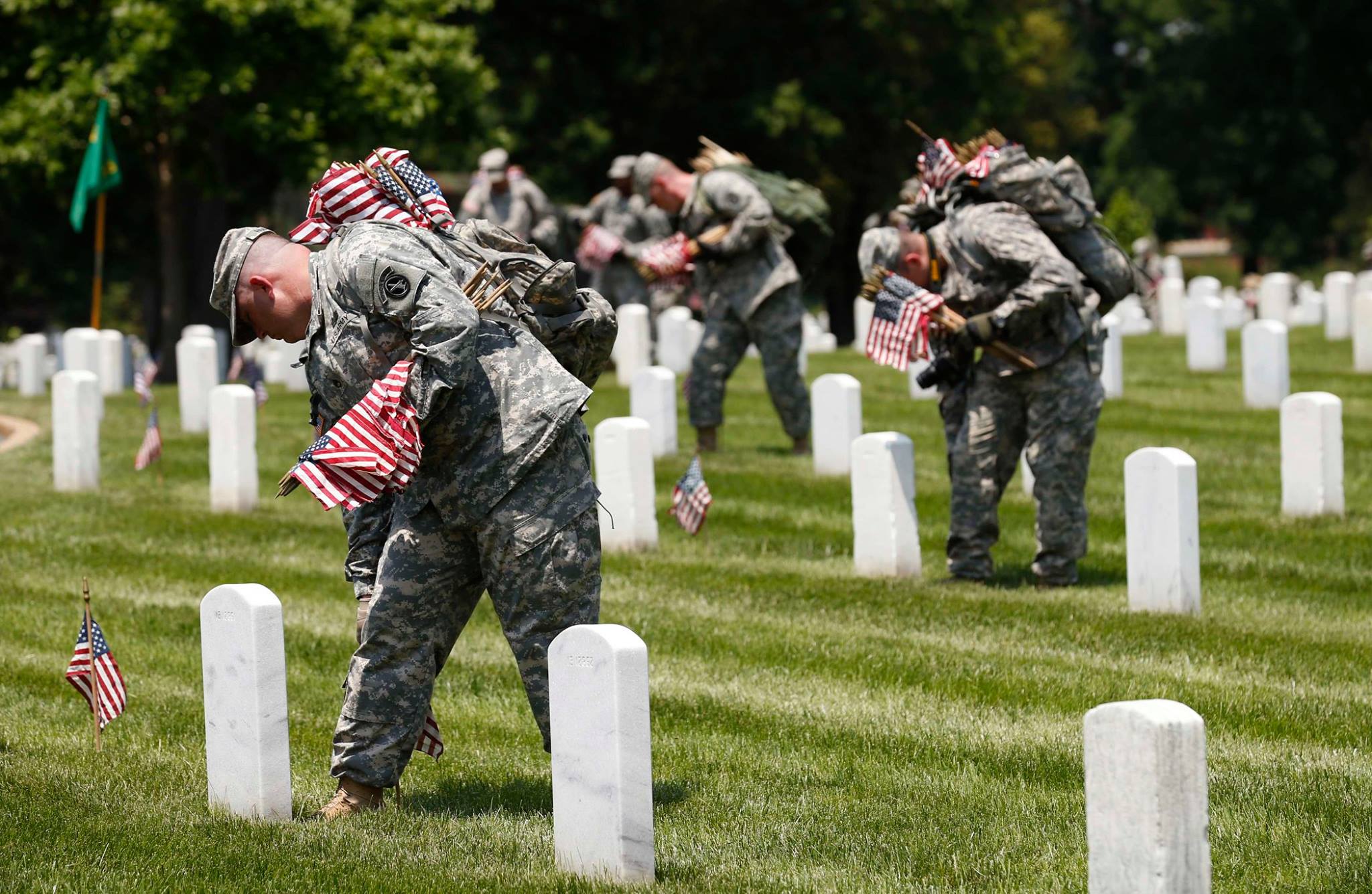 Military planting flags on Memorial Day