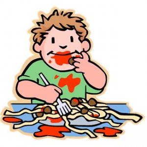 Boy eating spaghetti