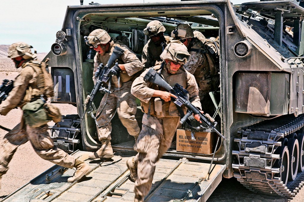 Marines dismounting from an amphibious assault vehicle