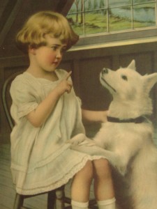 Little girl scolding puppy
