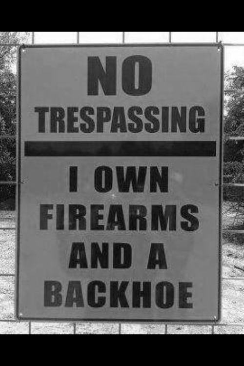 No trespassing firearms and a backhoe