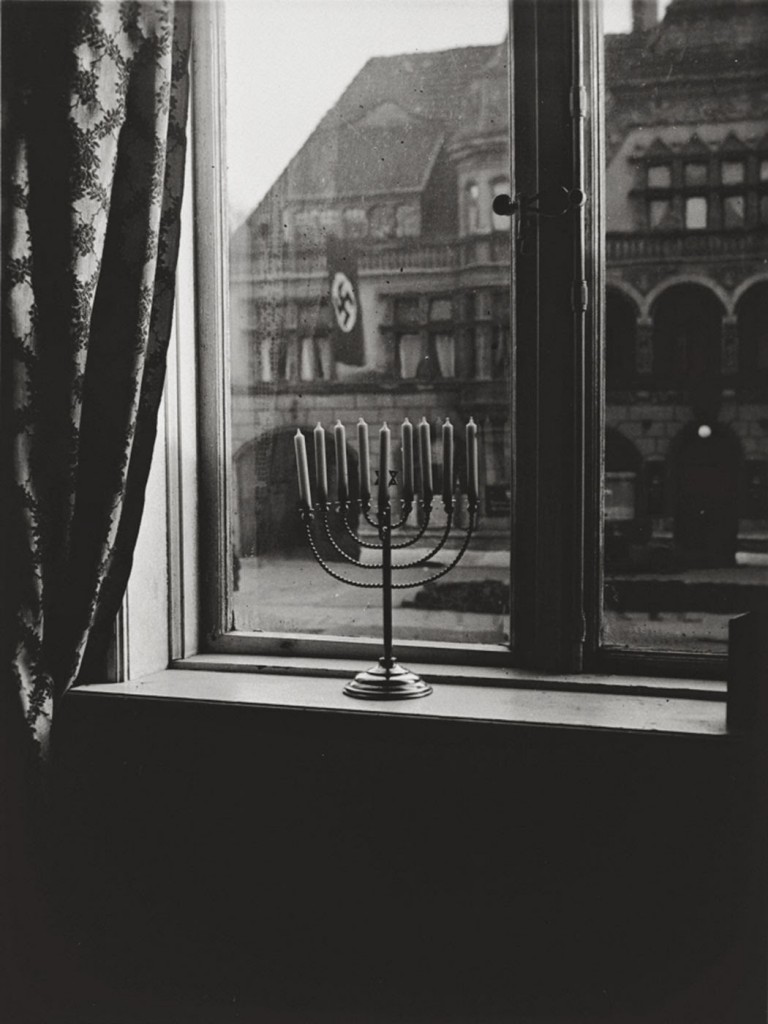 A menorah defies the Nazi flag , 1931