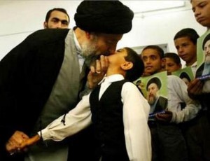 Old Afghan man kisses boy on mouth