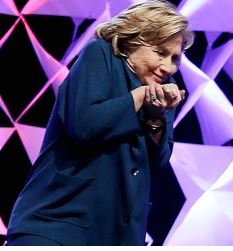 Hillary rubbing hands together