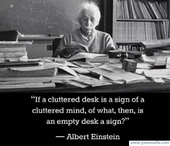 Wisdom Einstein on cluttered desk