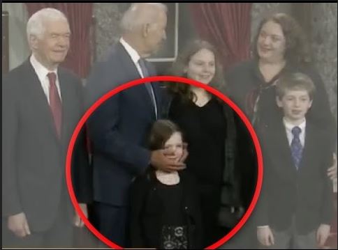Joe Biden fondling a little girl's face