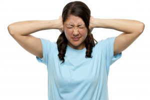 Person covering ears to drown out Trumps and Democrat candidates